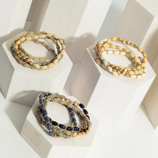 Set of Four Beaded Bracelets Featuring Gold Accents